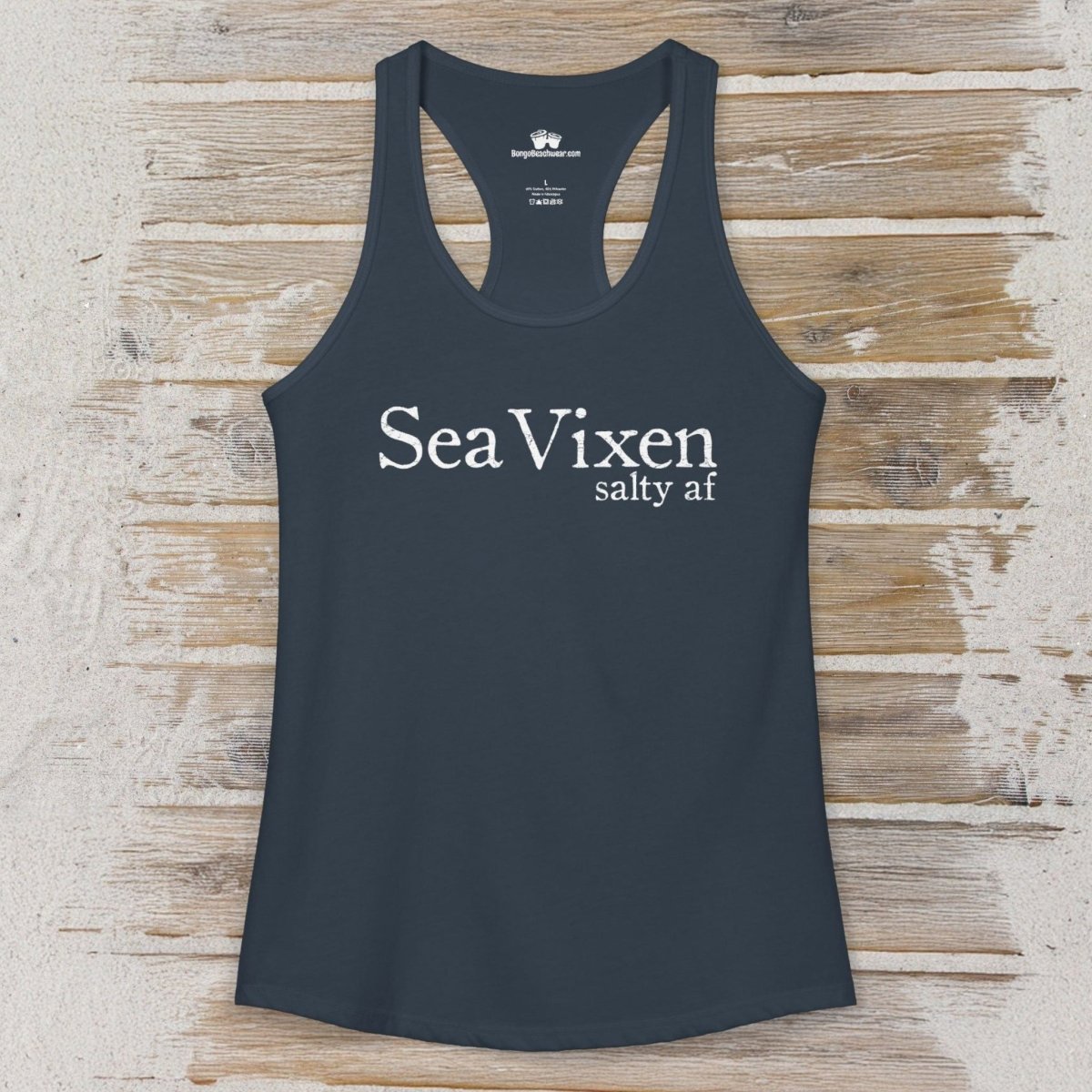 Black tank top with 'Sea Vixen salty af' text on a sandy wood surface