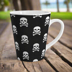 Latte Mug with skull and crossbones pattern sitting on a rustic old table in a Hawaiian beachside park