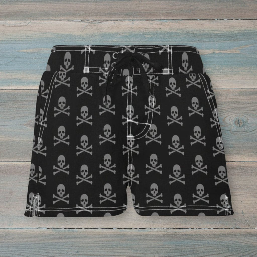 Black shorts with white accents on a rustic wood background