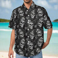 Dude wearing a black Hawaiian shirt with skull and crossbones pattern on a beach in the Caribbean Islands