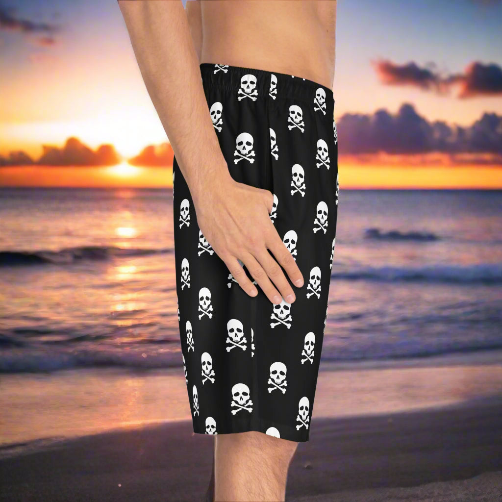 Side view of Guy wearing pirate swim shorts on the beach