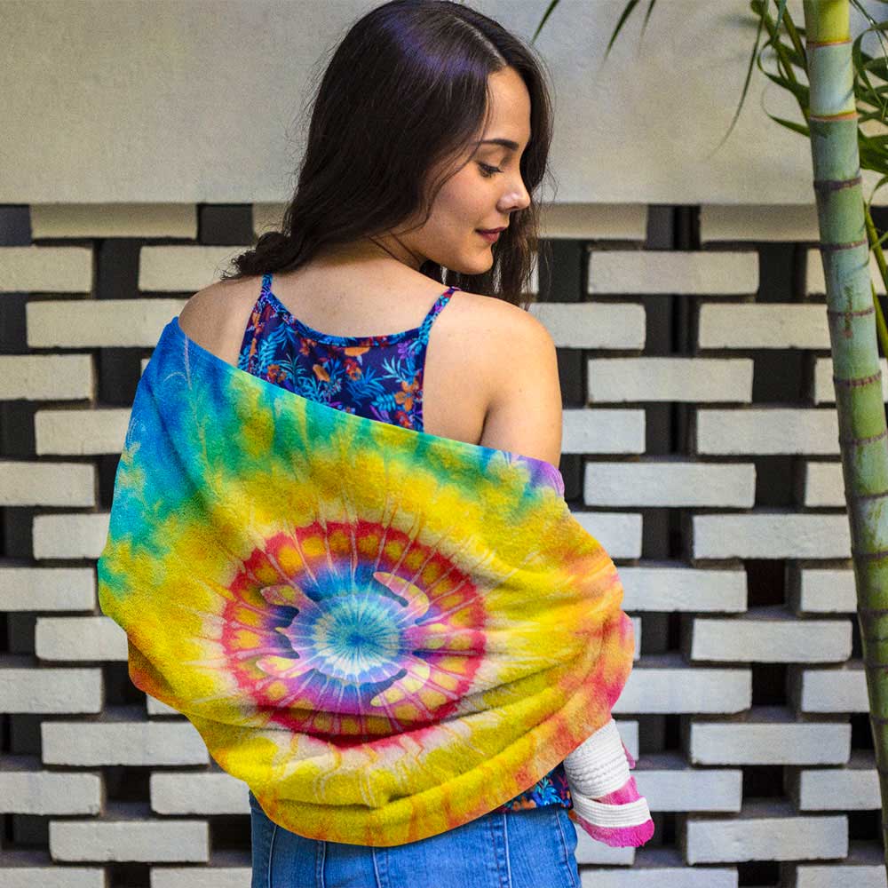 Swimsuit model wrapped in tie dye beach towel with cool sea turtle silhouette in center