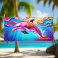 Cool psychedelic dolphin art on beach towel hanging on a line at surf camp