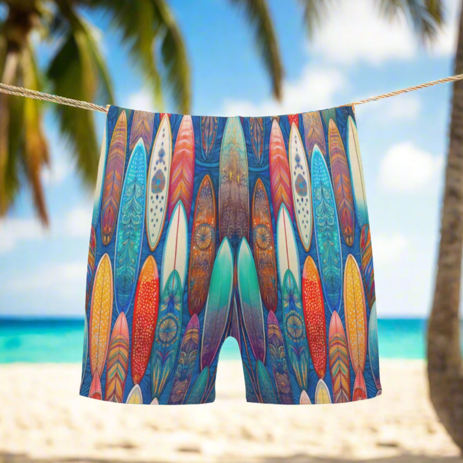 Colorful quick dry swim shorts shorts with a cool tiki surfboard pattern design hanging on a clothesline outside an old surfshack in Hawaii