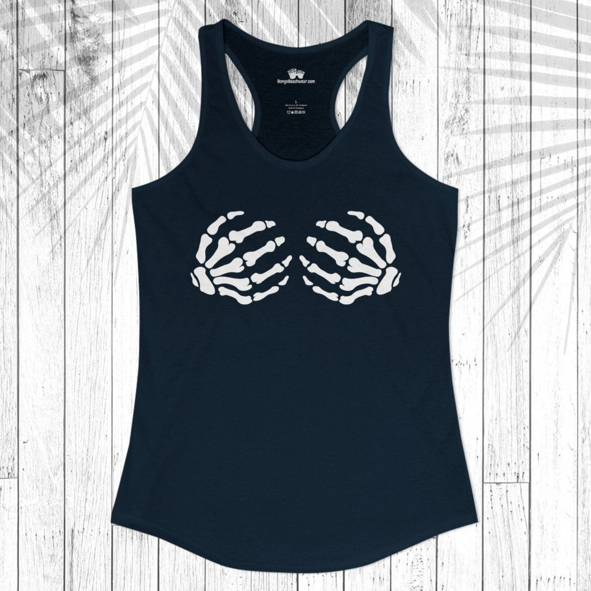 A navy blue racerback tank top with a white graphic of two skeletal hands forming a heart shape on the chest, displayed flat against a white wood plank background with a leaf shadow overlay.