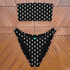 The eco-friendly bandeau bikini laying on the teak deck of a vintage sailboat