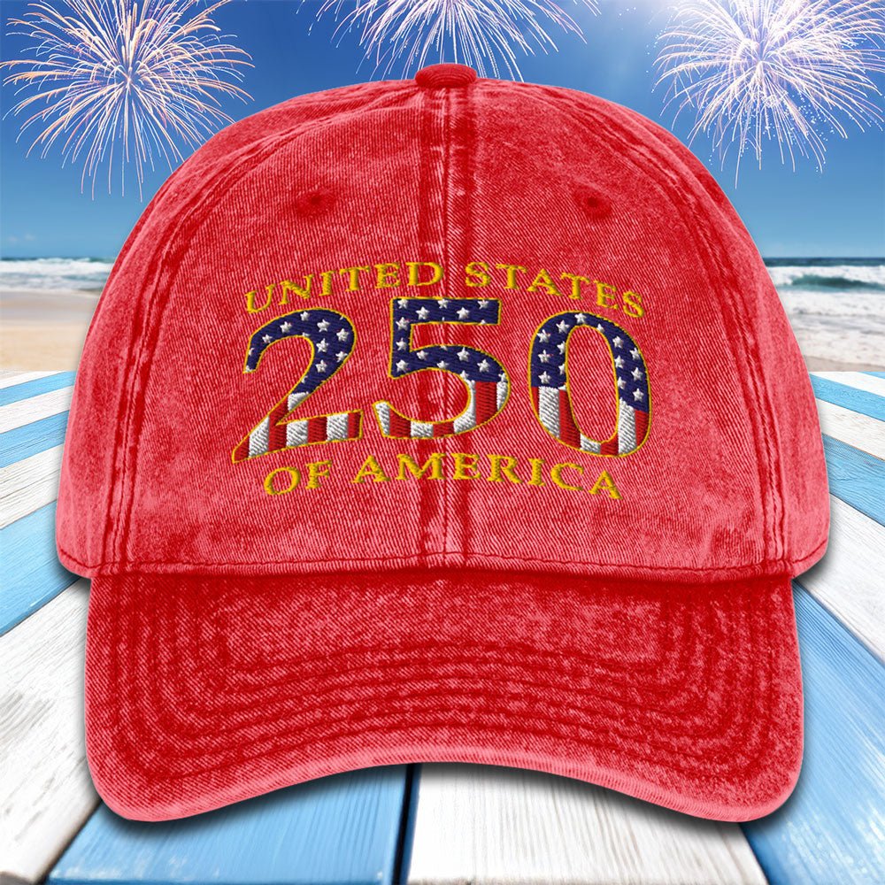 Red cap with 'United States 250 of America' text against a beach with fireworks background
