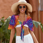 Swimwear model wearing sarong wrapped around her shoulders.