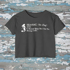 Navy blue t-shirt with white mermaid graphic and text on a rustic wood background