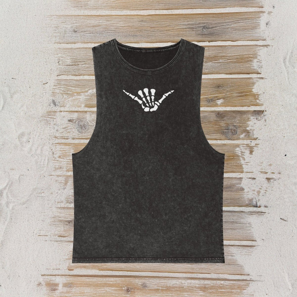 A dark charcoal gray sleeveless tank top with a white skeleton shaka hand sign graphic on the chest, laid flat on a rustic wooden plank background.