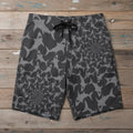 Infinite Shark Pattern Board Shorts on a rustic wood background