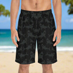 Men black shark pattern board shorts worn by surfer standing on the beach in Waikiki