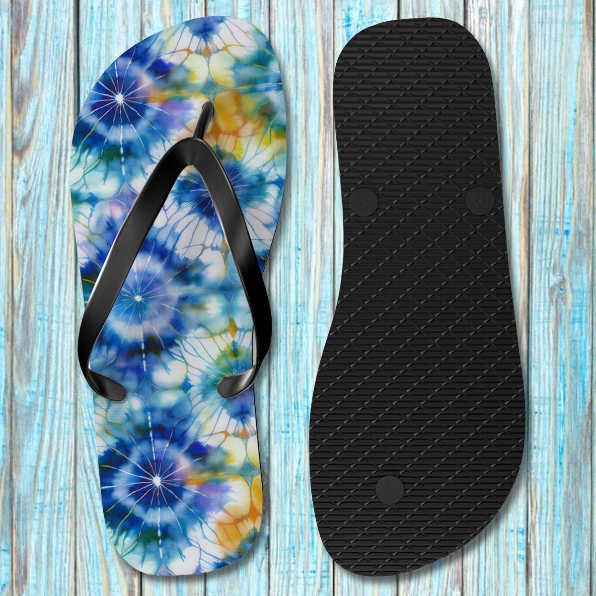 Flip-flop with tie-dye design on a wooden surface on upside down