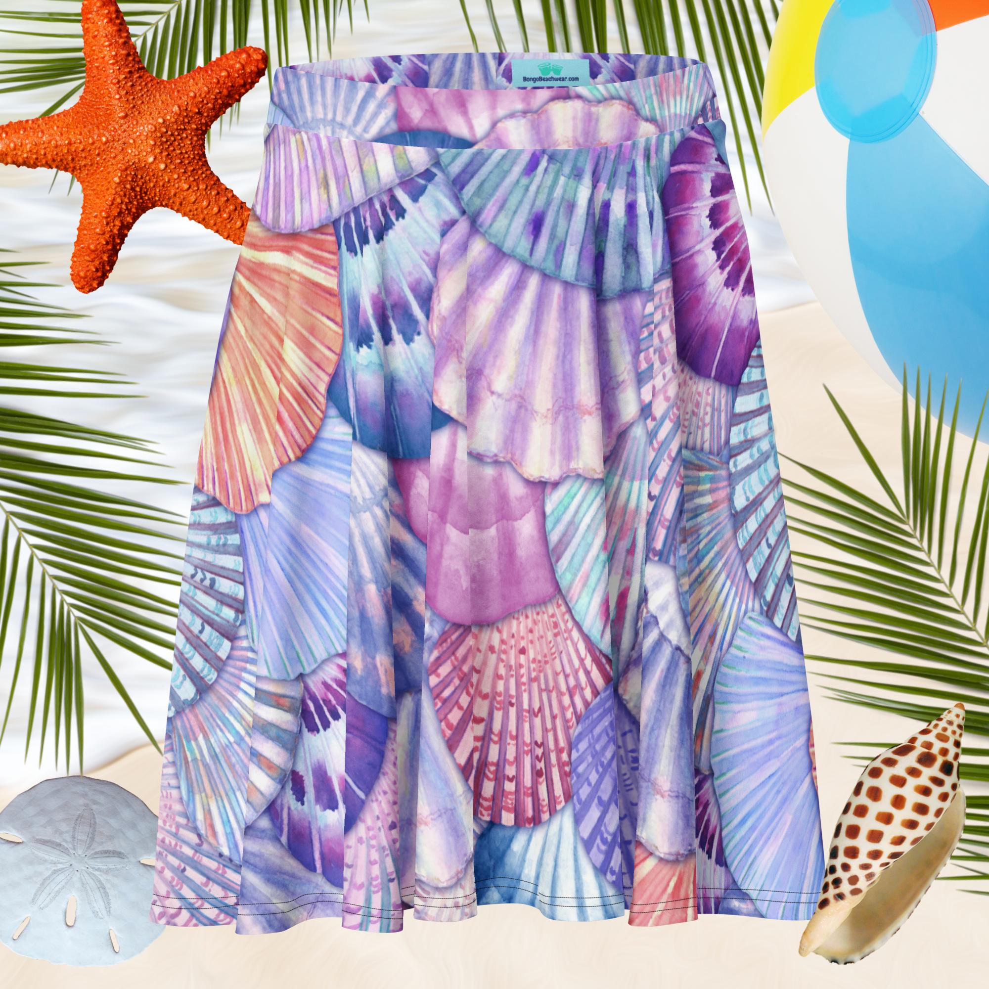 Colorful seashell patterned skirt with beach elements like starfish, shells, and palm leaves.