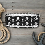 Black headband with white skull and crossbones pattern on a white background