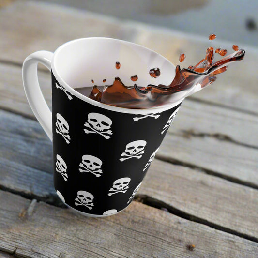 Skull & Crossbones Latte Mug with Edgy Black Design for Coffee Lovers on rustic beachside table with coffee splashing out of the cup