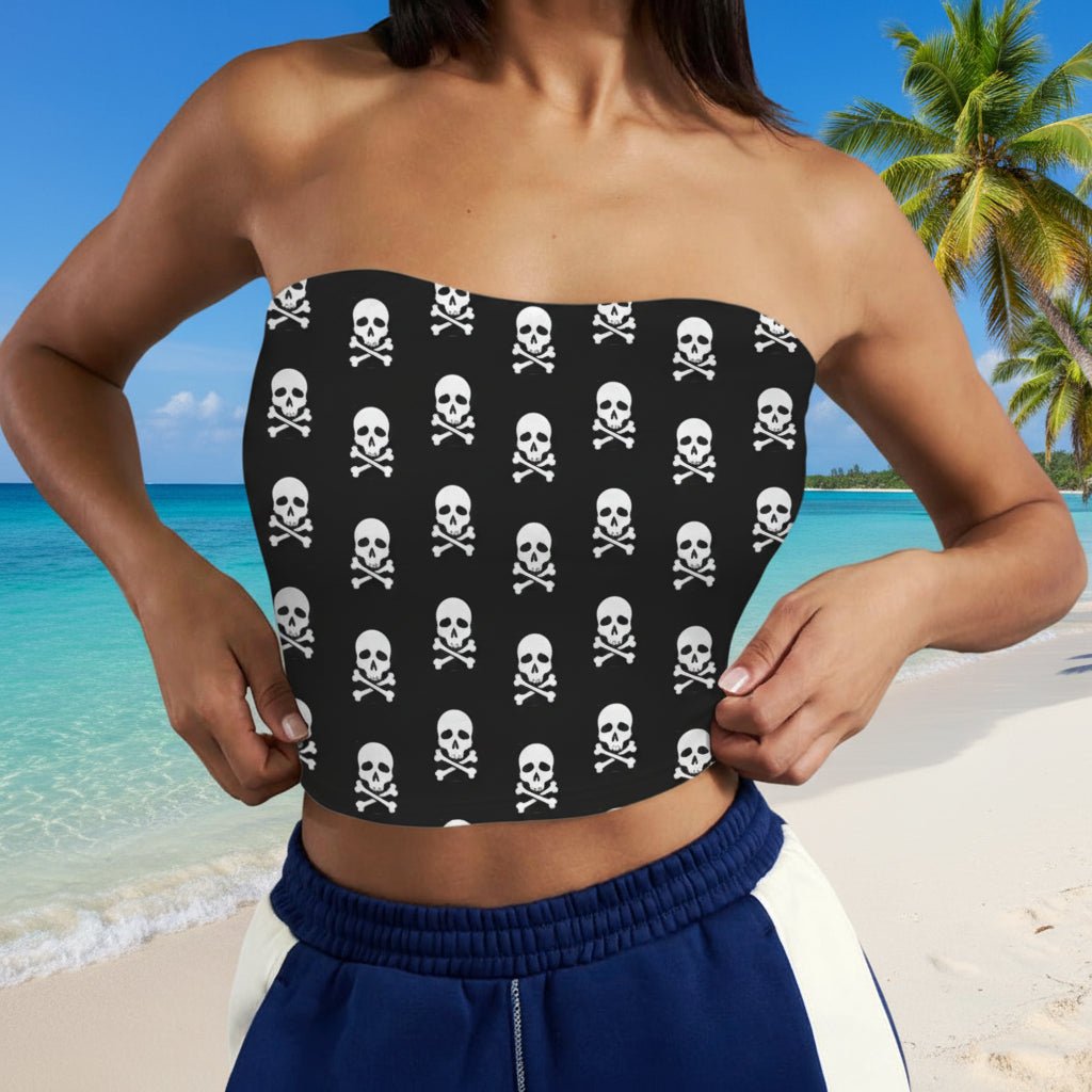 Woman wearing a strapless Skull Tube Top with skull and crossbones pattern a Caribbean Island Beach