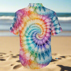 Colorful tie-dye shirt with a spiral pattern on a beach background