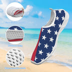 A slip-on water shoe with a navy blue upper covered in white starfish patterns, a red side panel, and a white sole, shown over a beach background. Three circular inset callouts highlight features: super flexible and soft material, breathable lining, and a water-permeable outsole.