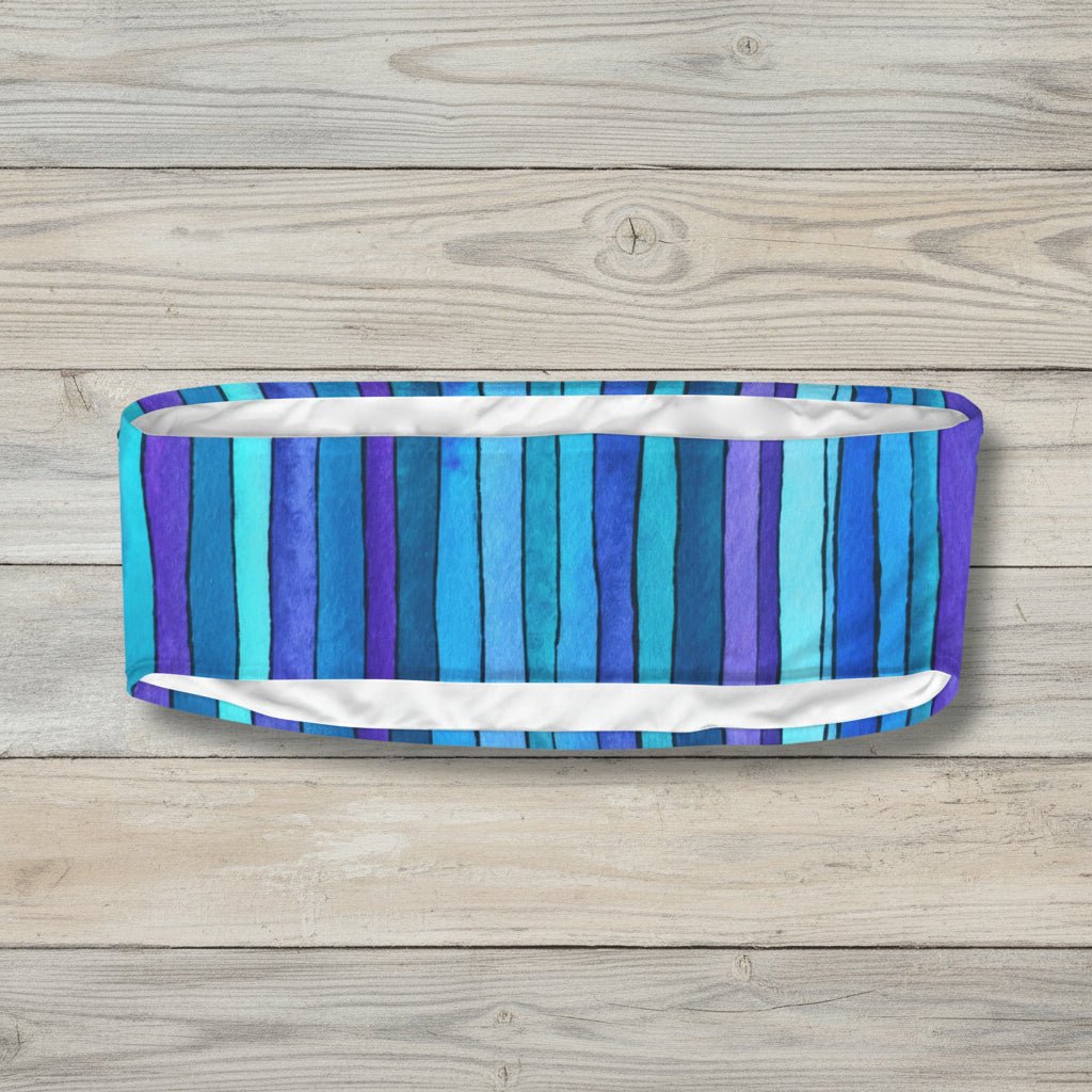 Striped bikini bottom with blue and purple pattern on a white background