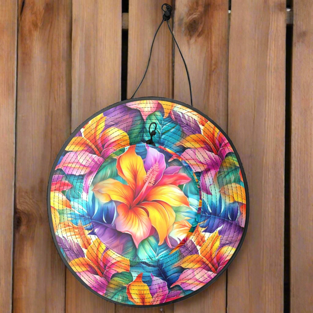 Colorful floral-patterned summer hat with a drawstring hanging on the wall of a beachside surf shack 