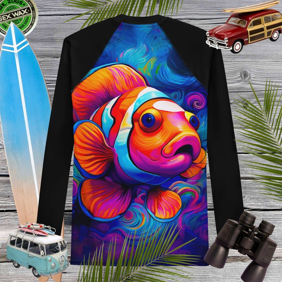 Colorful Clown fish design on a black rashie with surfboard, car, and binoculars in the background.