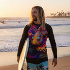 Dude wearing a black long-sleeve Sun Rashie with a colorful lion fish design on  Sunset Beach California