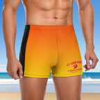 dude wearing a colorful swim short with a beach background