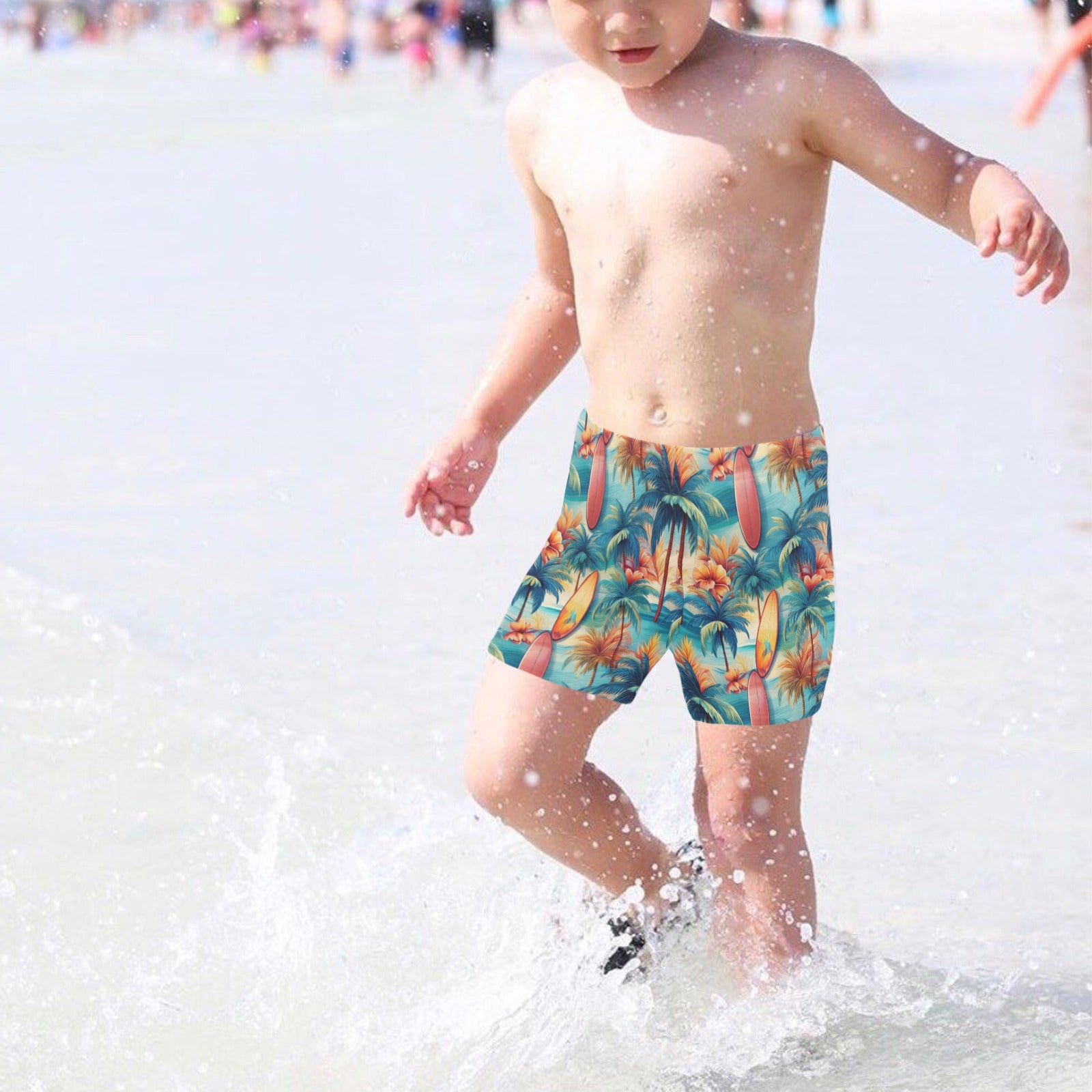 Child wearing colorful tropical surf print shorts playing in shallow water.