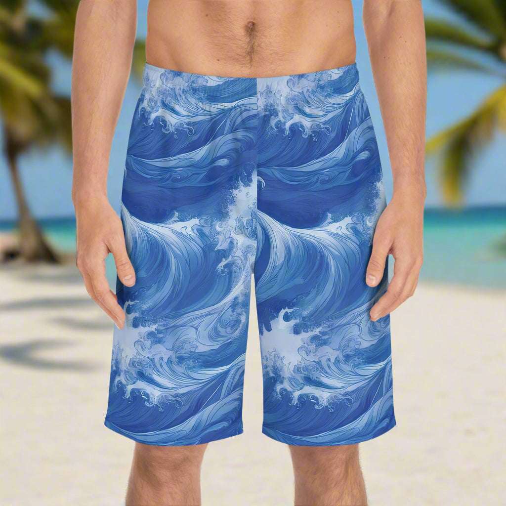 Guy wearing Long Board shorts with cool ocean wave pattern standing on the beach