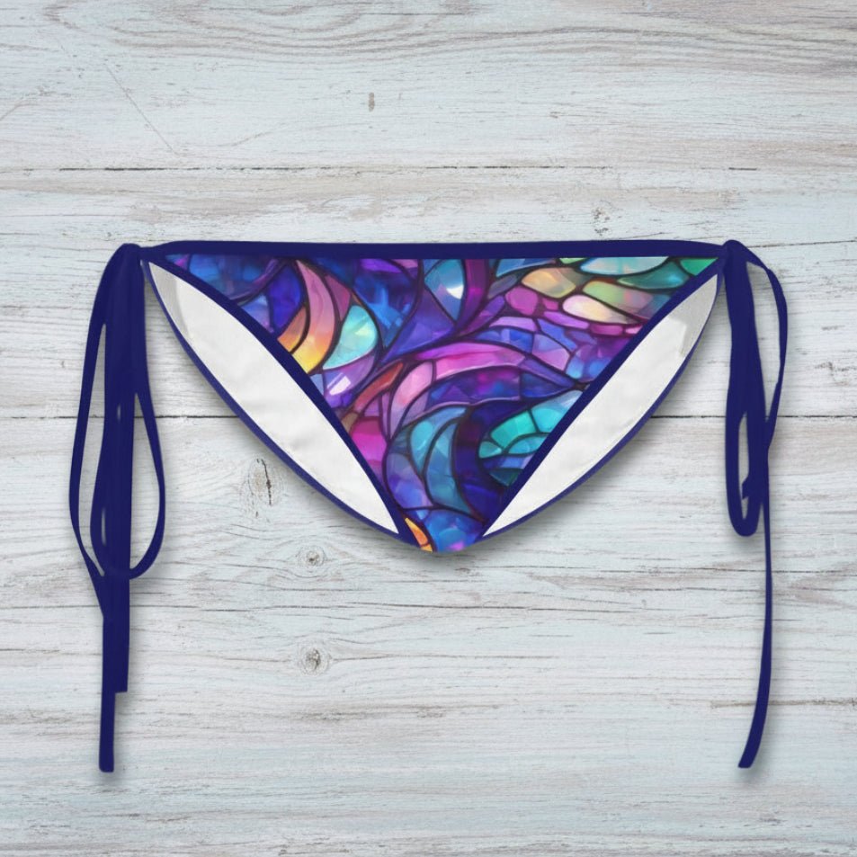 Colorful bikini bottom with tie sides on a faded nautical wood background
