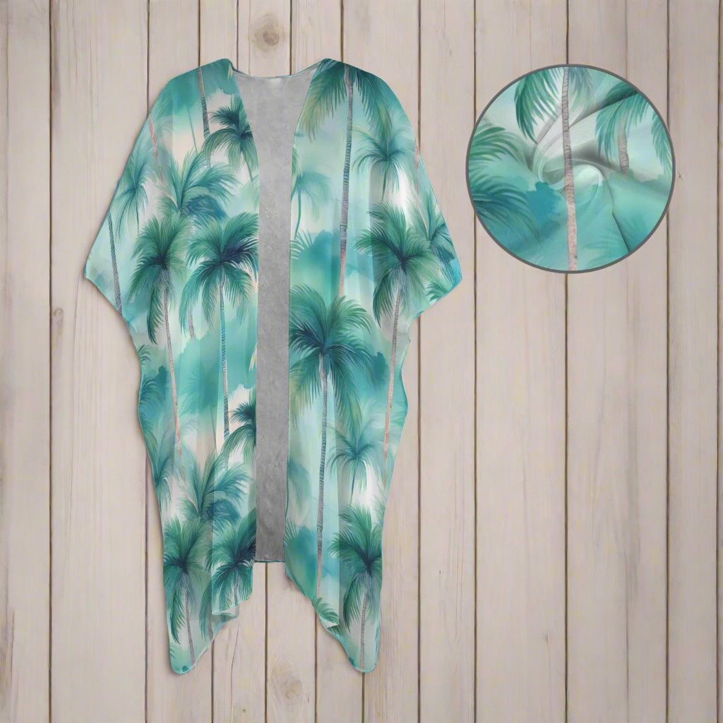 Green palm tree patterned beach coverup with a close-up inset on a nautical wood background