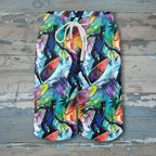 Colorful tropical-themed shorts with a white drawstring on a white background