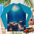 back of Blue rash guard with underwater design of treasure chests and surfboard, ukulele, and toy vintage car in the background.