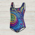 Colorful swimsuit with an island tribal pattern on a rustic wood background
