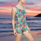 Woman wearing one piece bathing suit with vintage beach pattern on the beach