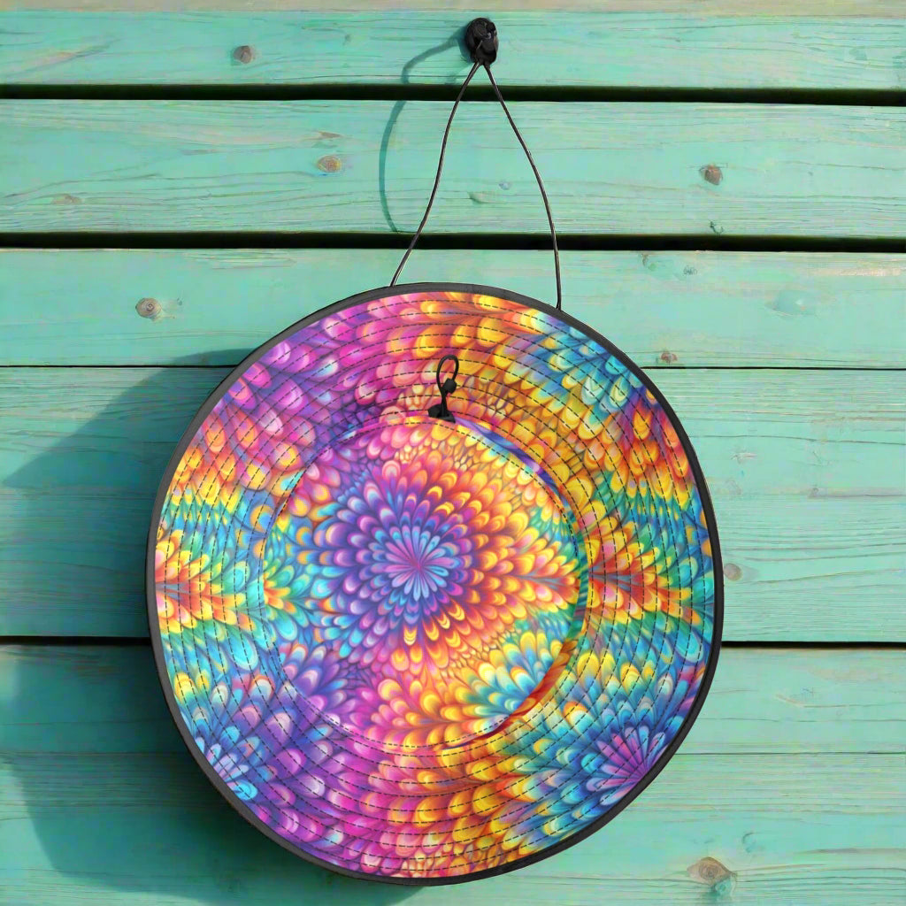 Colorful tie-dye round mat with a handle on a white background
