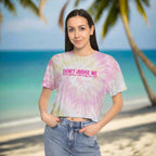 Beachwear model wearing a cute tie-dye crop top on the beach