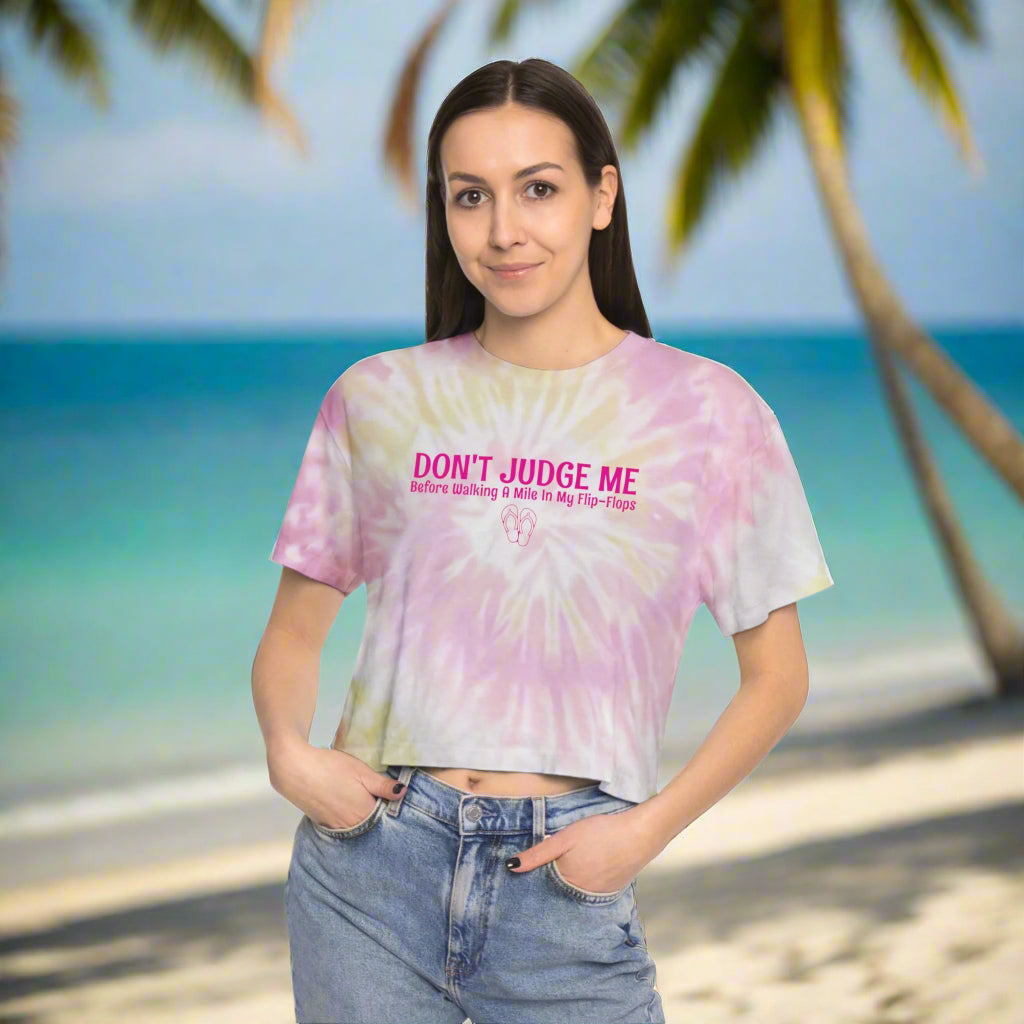 Beachwear model wearing a cute tie-dye crop top on the beach