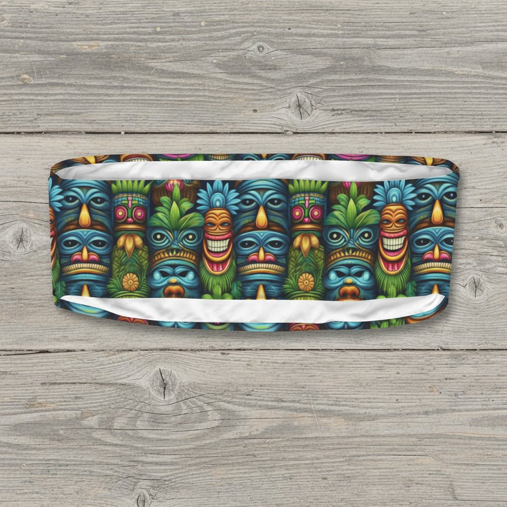 Colorful bandeau top with tiki mask pattern on a rustic wood background