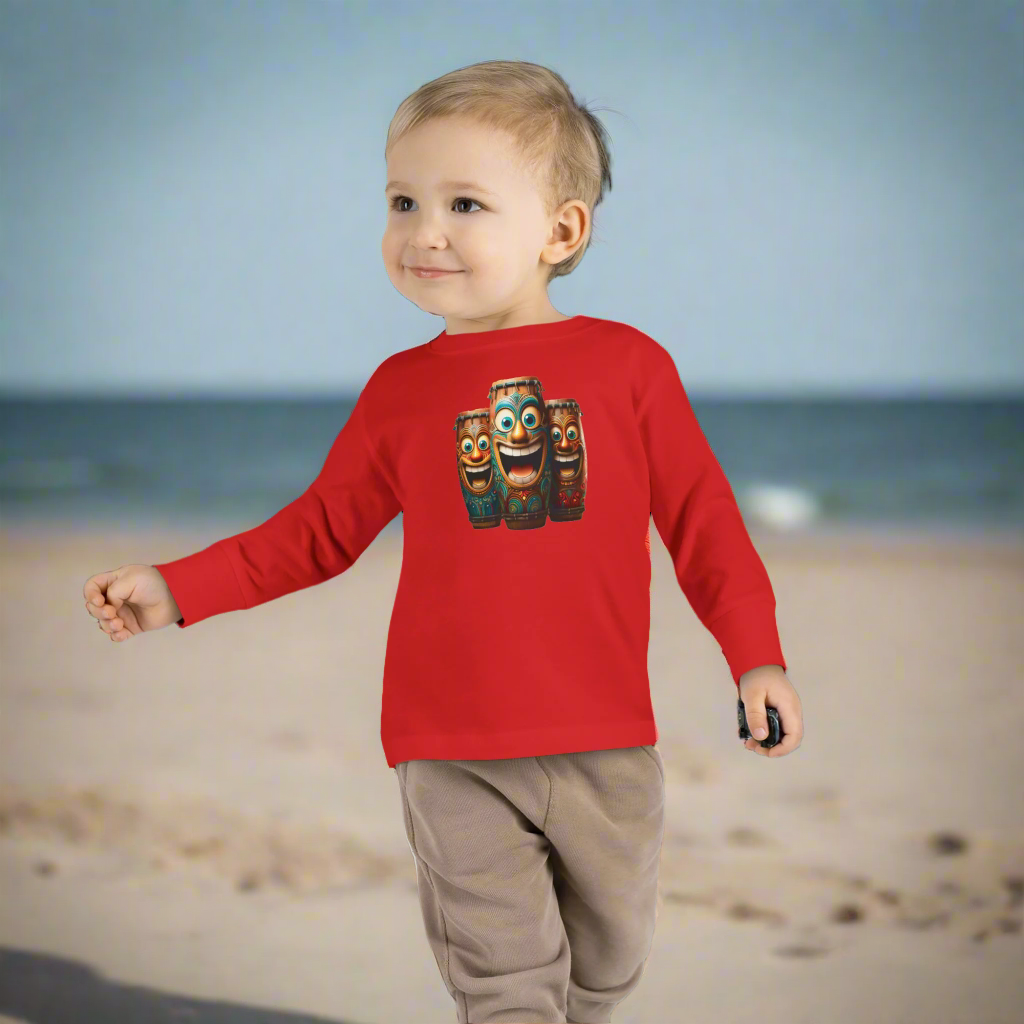 Child wearing a red long-sleeve shirt with a graphic design on a white background
