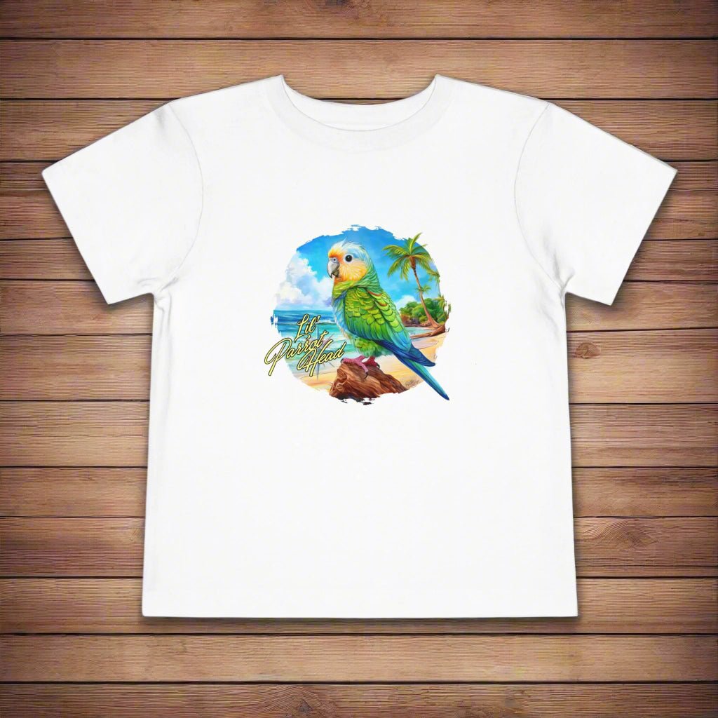 White t-shirt with a colorful parrot graphic on a wooden surface