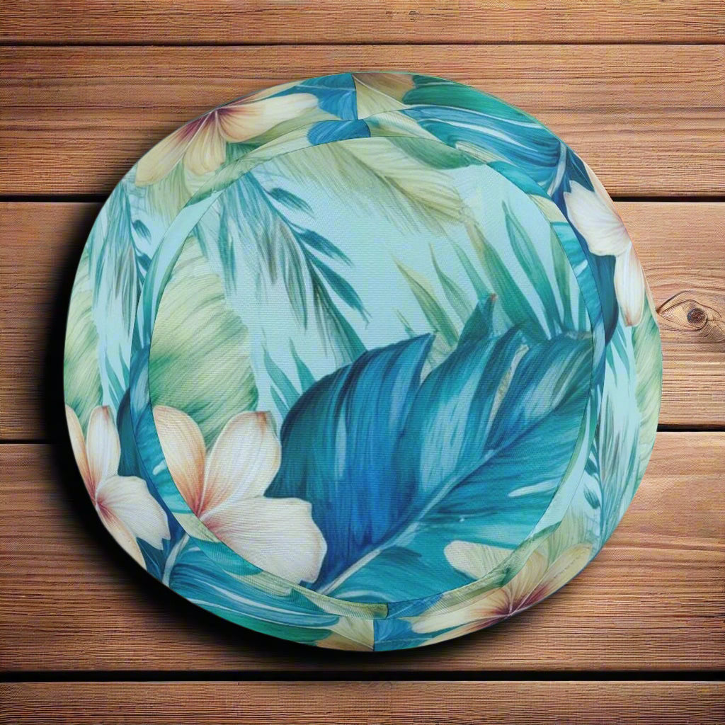 Top view of a Bucket Hat with tropical leaf and flower design on rustic nautica wood background