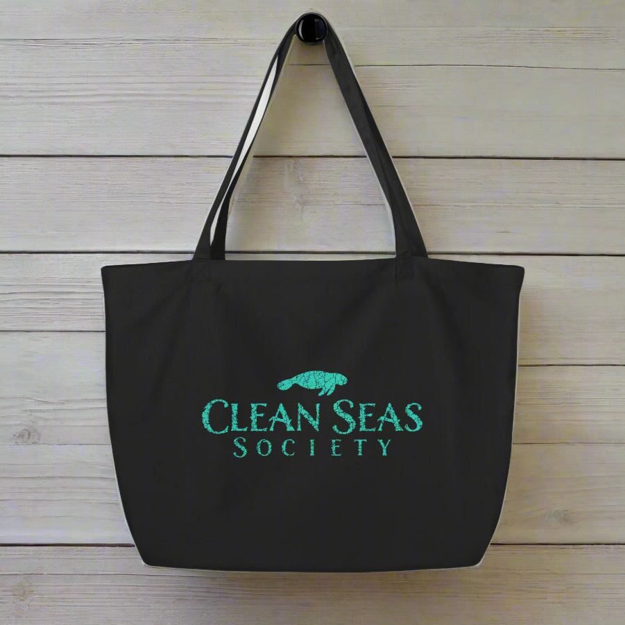 Large organic tote bag | Clean Seas Society Tote Bags hanging on rustic nautical wood wall
