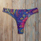 Colorful patterned bikini bottom on a rustic wood background
