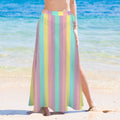 woman wearing a colorful striped sarong bikini cover on a beach