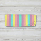 Pastel striped bandeau top on a nautical wood background