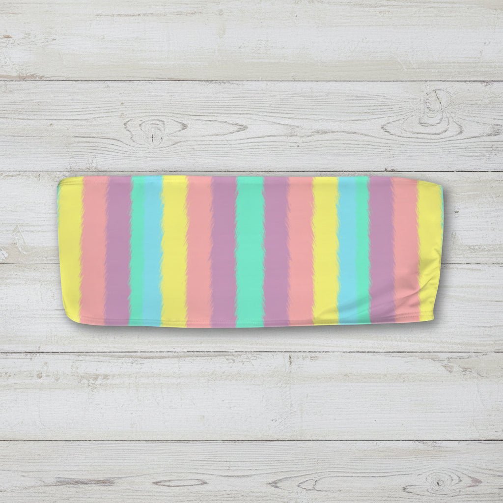 Pastel striped bandeau top on a nautical wood background