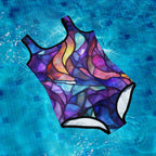 Colorful Tweens swimsuit on a blue tiled pool floor