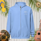 Light blue ParrotHead Hoodie with a logo on a wooden background with tropical elements.